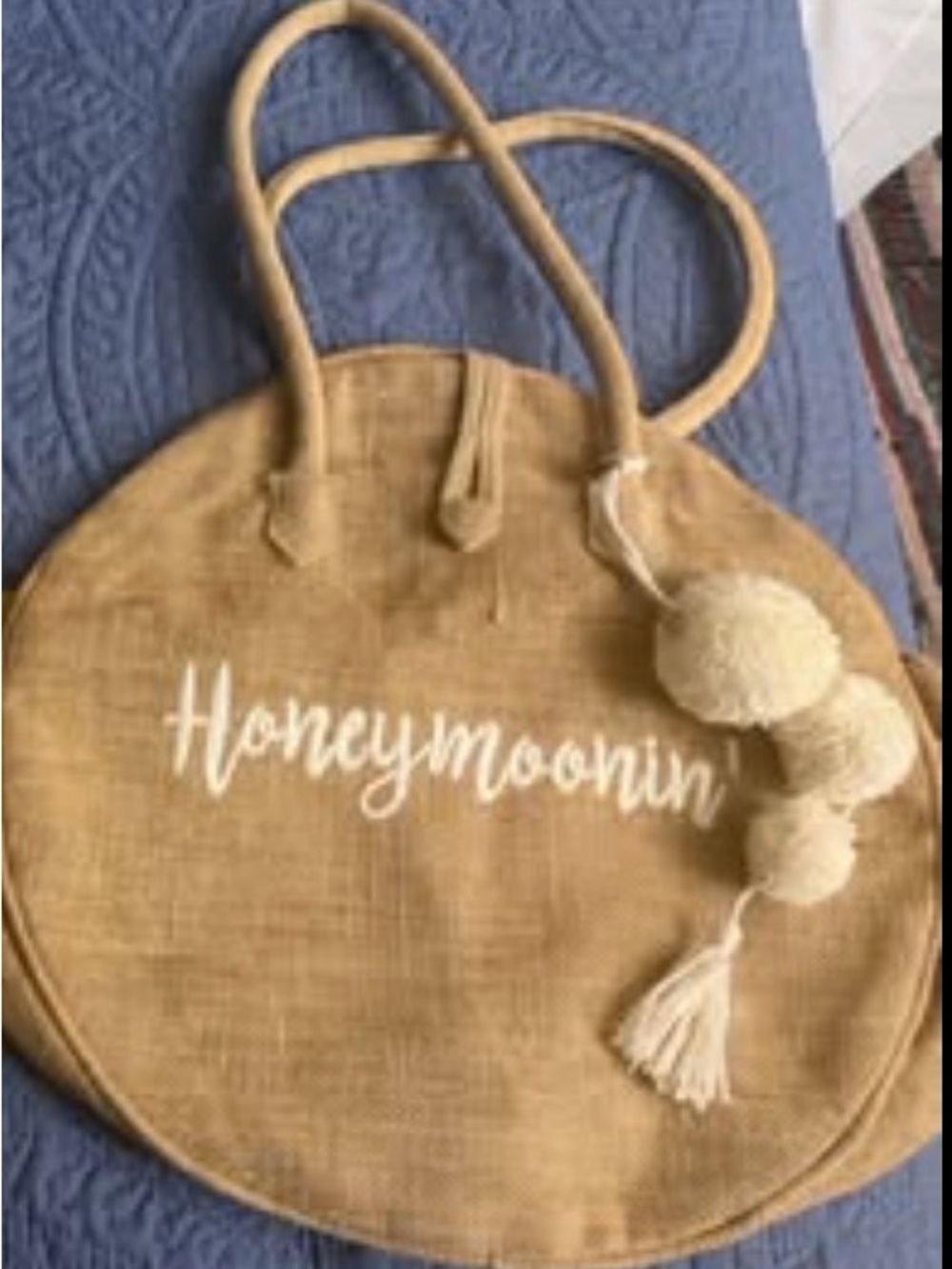 Round Jute Tote Bag with Pom-Pom Accent in Tan